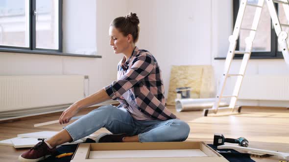 Woman Unpacking New Furniture Details at Home