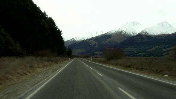 A first person view of driving through the beautiful country of New Zealand