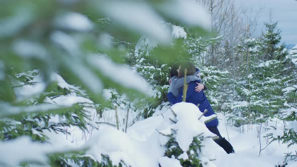 Girls hugging in a snowy forest