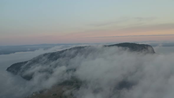 Mount Kineo sunrise thick fog aerial, Tracking left