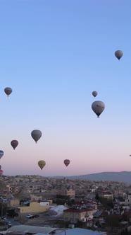 Vertical Video of Hot Air Balloons Flying in the Sky Over Cappadocia Turkey