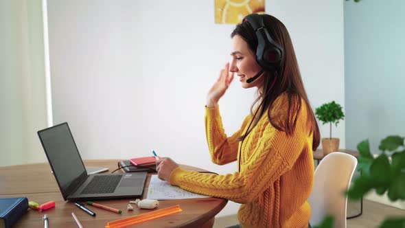 Girl Student Talking Online Via Webcam Using Video Call with Teacher