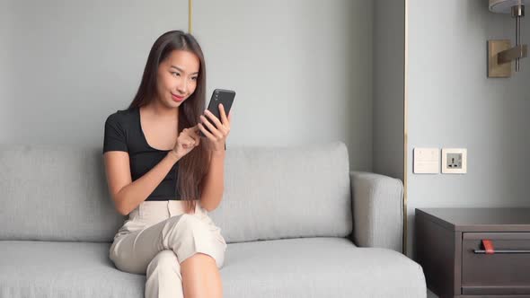 Young asian woman use smart phone