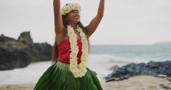 Woman performing Hawaiian hula on the beach