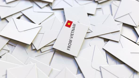 Envelope with From Vietnam Text on Pile of Other Envelopes alt