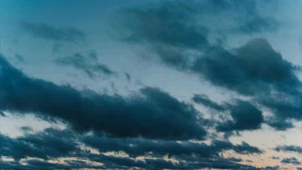 Time Lapse Clouds Float at Sunset