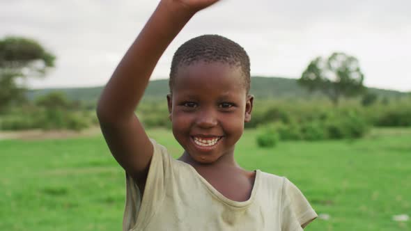 Maasai girl waving hand