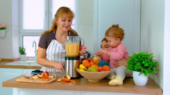 The Family Prepares Smoothies at Home