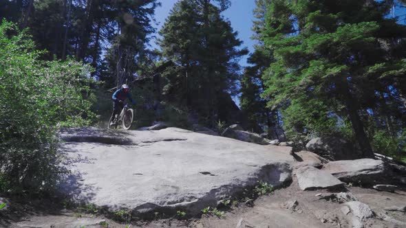 Mountain Biker- Solo descend over large rock face