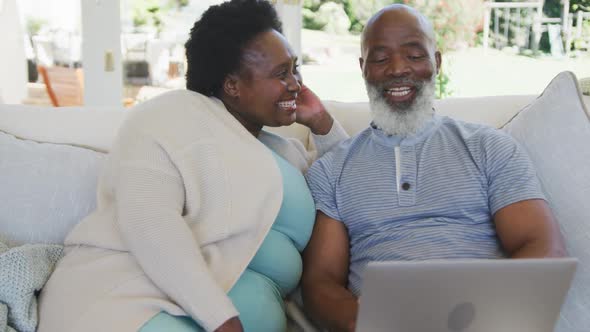 Happy senior african american couple smiling