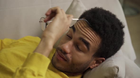 Portrait of a Young Man Lying on a Couch