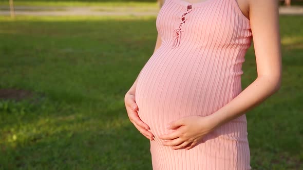 Pregnant Woman Feeling Happy Taking Care of Her Child