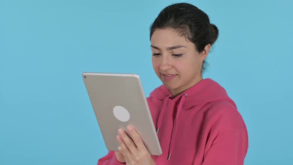 Indian Girl Using Tablet  Blue Background