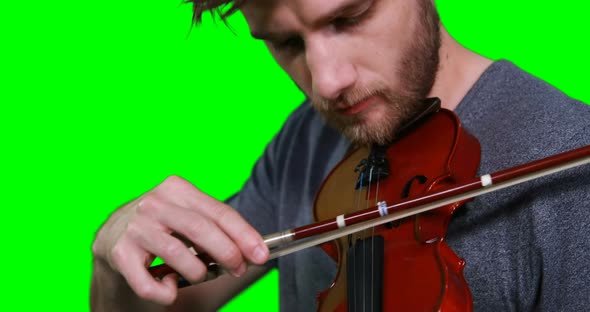 Close-up of male musician playing violin