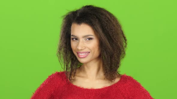 Afro American Woman Flirts and Winks at Eye, Green Screen