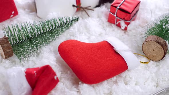 Different Christmas Objects Lay Out on Snow Background