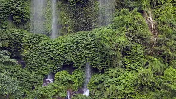 Not yet well developed for tourism Waterfall.Buttery soft aerial view flight point of view POV shot