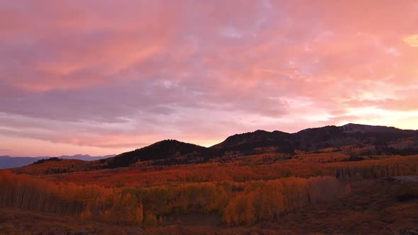 Panning view during colorful sunset over Fall color in Utah