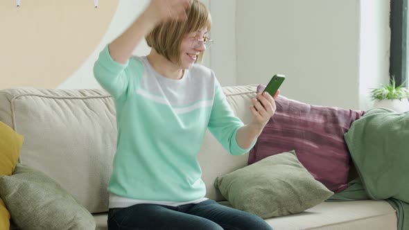 Excited Senior Woman Surprised By Good Unbelievable News Looking at Smartphone Screen