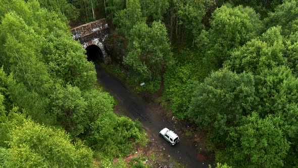 Aerial View of the Car Entering the Tunnel