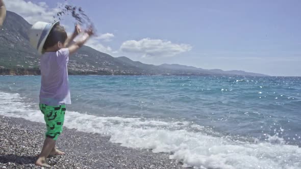 Three Years Old Child Enjoys The Sea At Kalamata Beach Greece SLOW MOTION