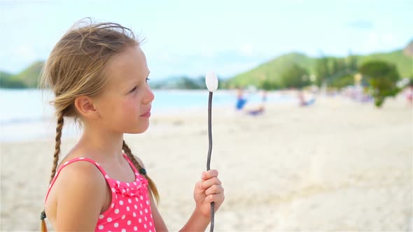 Adorable Little Girl at Beach Having a Lot of Fun. SLOW MOTION