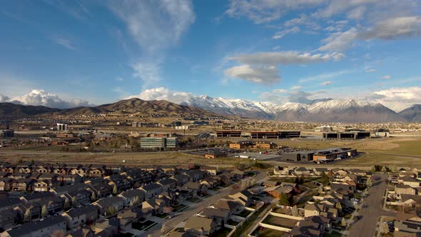 Office building and a suburban neighborhood in an idyllic setting with the snowy mountains in the ba