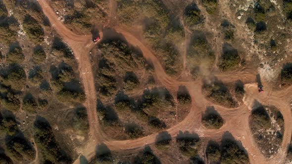 Wide aerial view of ATVs having fun in on the dirt trails in Cavo Greko