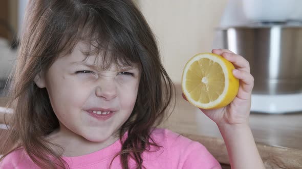 Child with lemon.