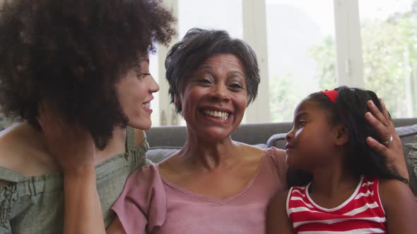 Mixed race woman spending time with her mother and her daughter