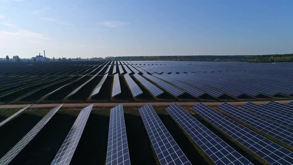 Aerial Drone Footage. Flight Forward Over Solar Panel Farm. Renewable Green Alternative Energy