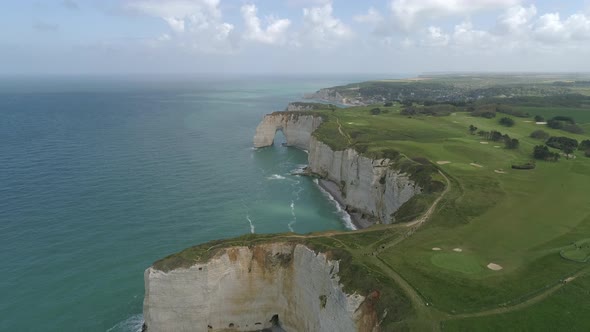 Porte d'amont arch, cliff rock formation in Etretat coastline, aerial