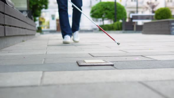 Young Blind Man with with a Cane Alone Outdoors