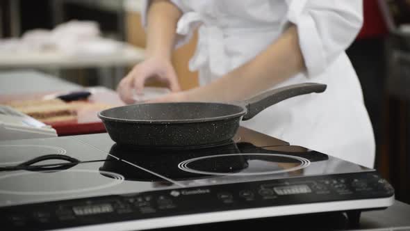 The Pan Is Heated on an Electric Stove