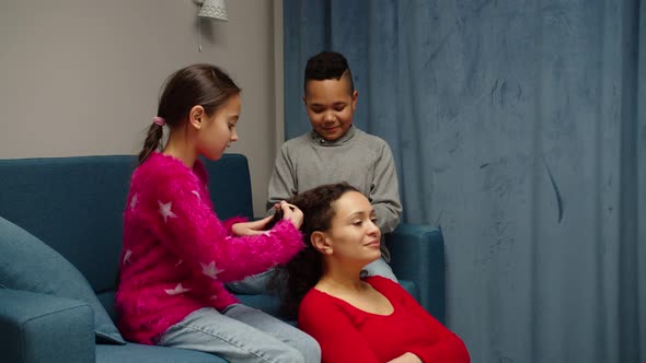 Multiethnic Kids Caring About Mom Playing Game of Hairdresser at Home