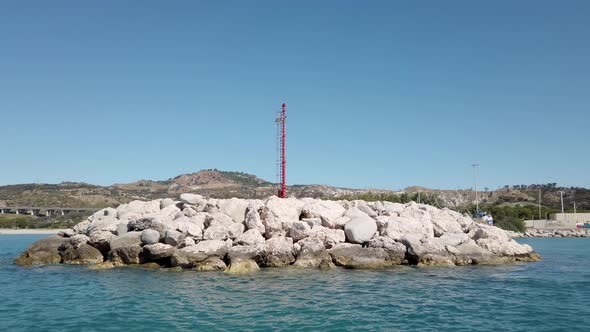 Sailing with the dinghy on the sea departing from the Port