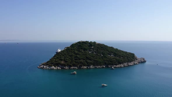 Green Rocky Island in the Blue Sea