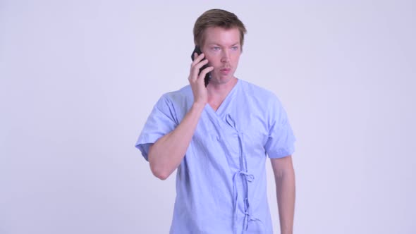 Young Man Patient Talking on the Phone and Farting