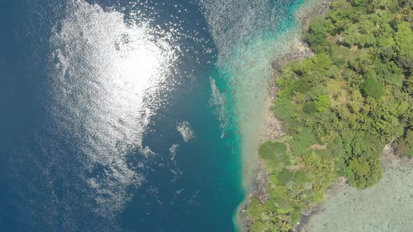 Aerial: flying over Banda Islands active volcano Gunung Api lava flow Indonesia 