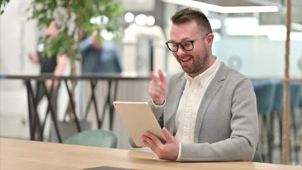 Creative Man Doing Video Call on Tablet