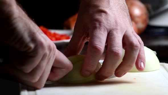 Chopping an onion in fine brunoise. Close shot.