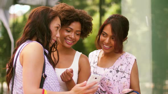 Women with Smartphones and Shopping Bags in City 31