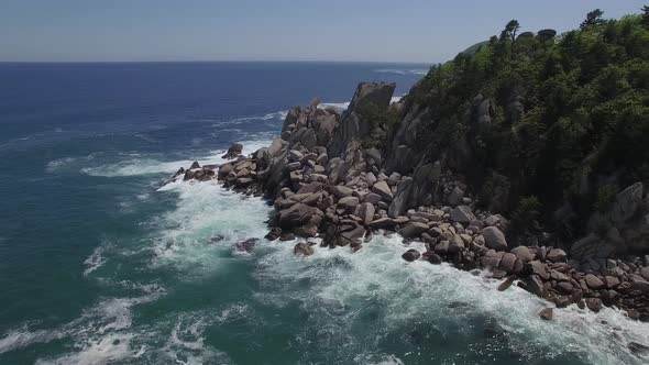 View From a Droneon a Stone Cape Washed By Strong Waves