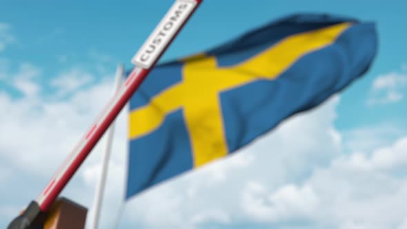 Closing Boom Barrier with CUSTOMS Sign at the Swedish Flag