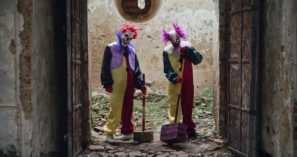 Two Scary Clowns Open The Door