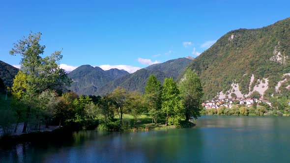 Flying Low Over a Lake surrounded by beautiful mountains