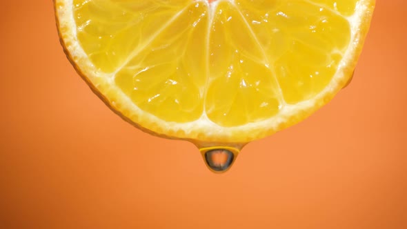 Water Dropping on an Orange Slice , Fruit for Diet and Healthy Food. Orange Backgrond