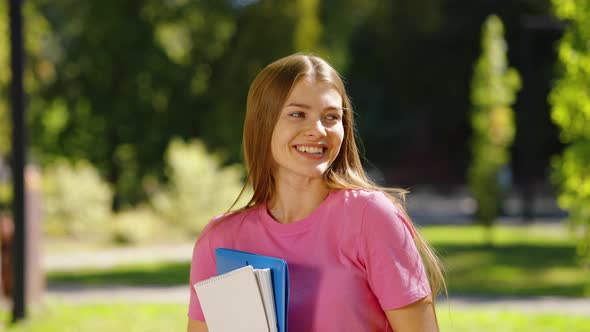 Female Student Laughing in Park