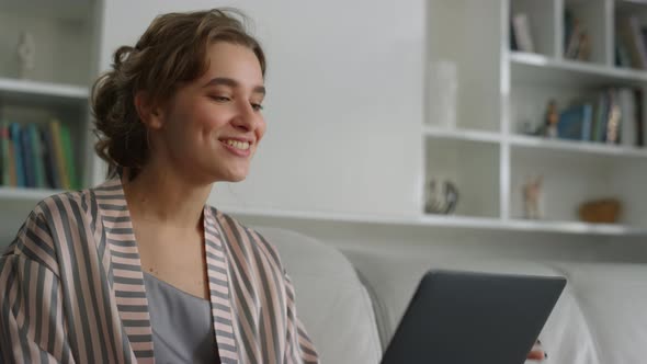 Smiling Student Having Video Call in Living Room Closeup