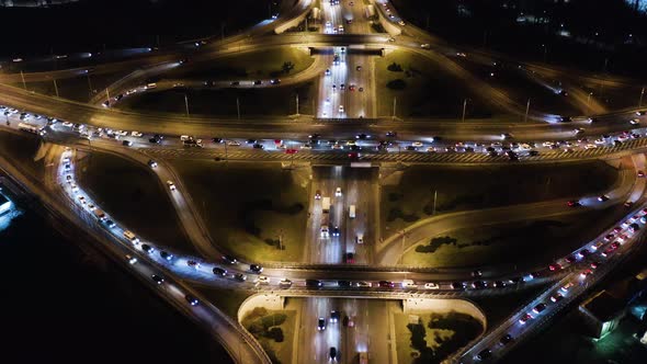 Night Aerial Urban Traffic Road System. Busy Downtown 